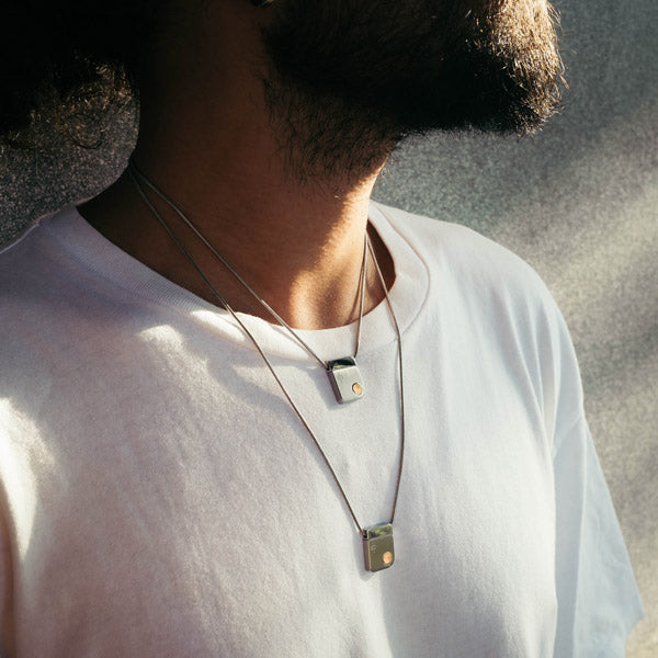 Man wearing QiOne 2 Pro Necklace