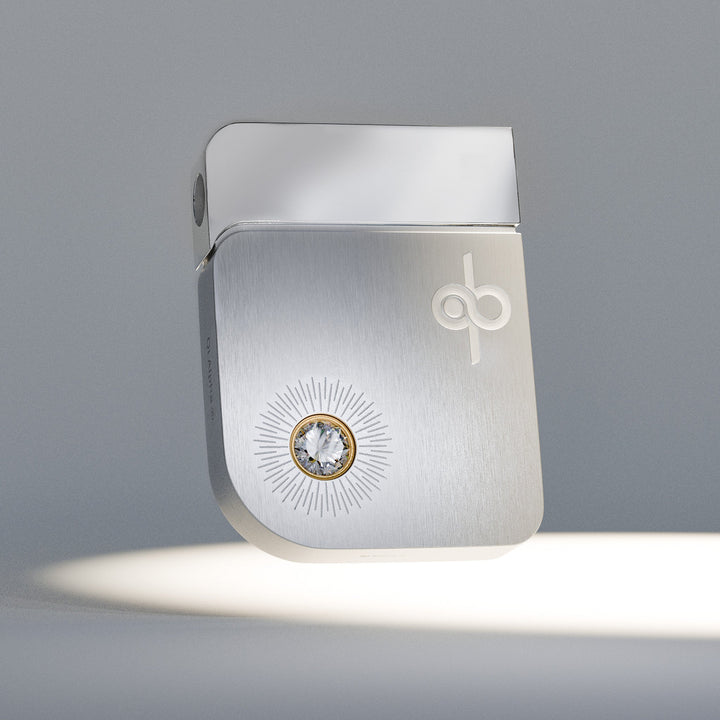 Qi Alpha, front with the diamond in its gold setting